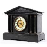 A 19th century slate 8 day bracket clock with four brass pillar supports