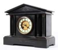 A 19th century slate 8 day bracket clock with four brass pillar supports