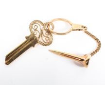 A 9ct gold key ring with 9ct key and golf tee, 21.
