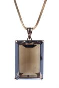 An 18ct gold necklace with yellow metal large set smoky quartz pendent, chain weighing 10.