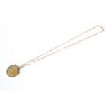 A Victorian 1868 gold full sovereign on chain Condition Report: 9 ct gold chain,