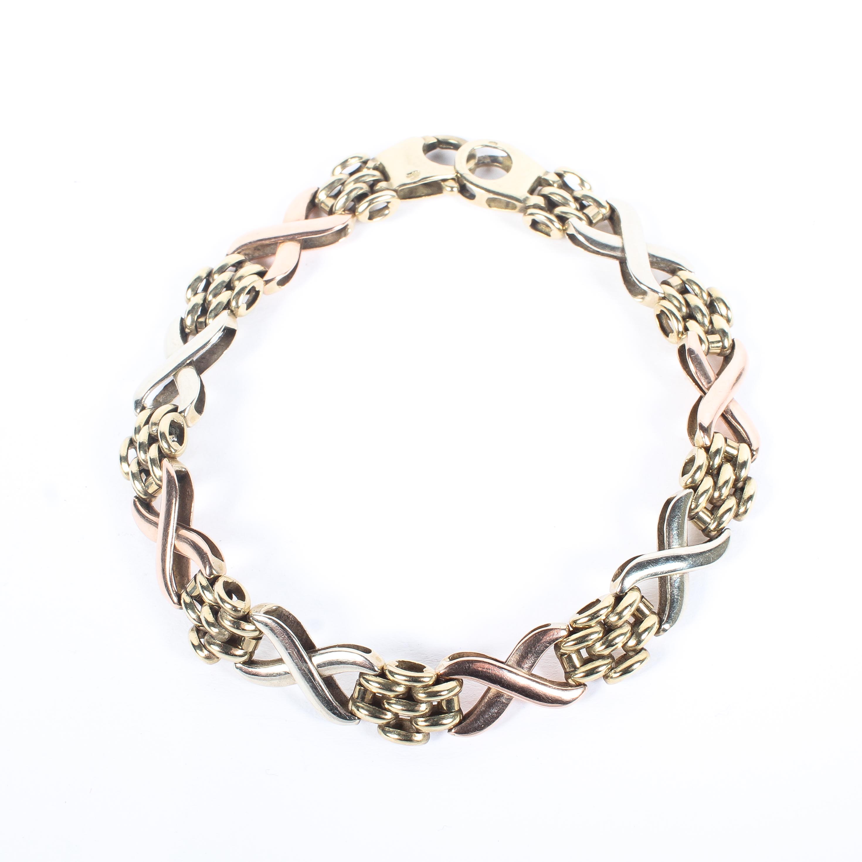 A 9ct gold tri-colour link bracelet, 11.