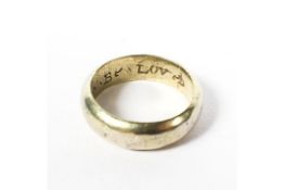 A mid-16th century/early 17th century yellow metal posy ring, with thick D-shape cross section hoop,