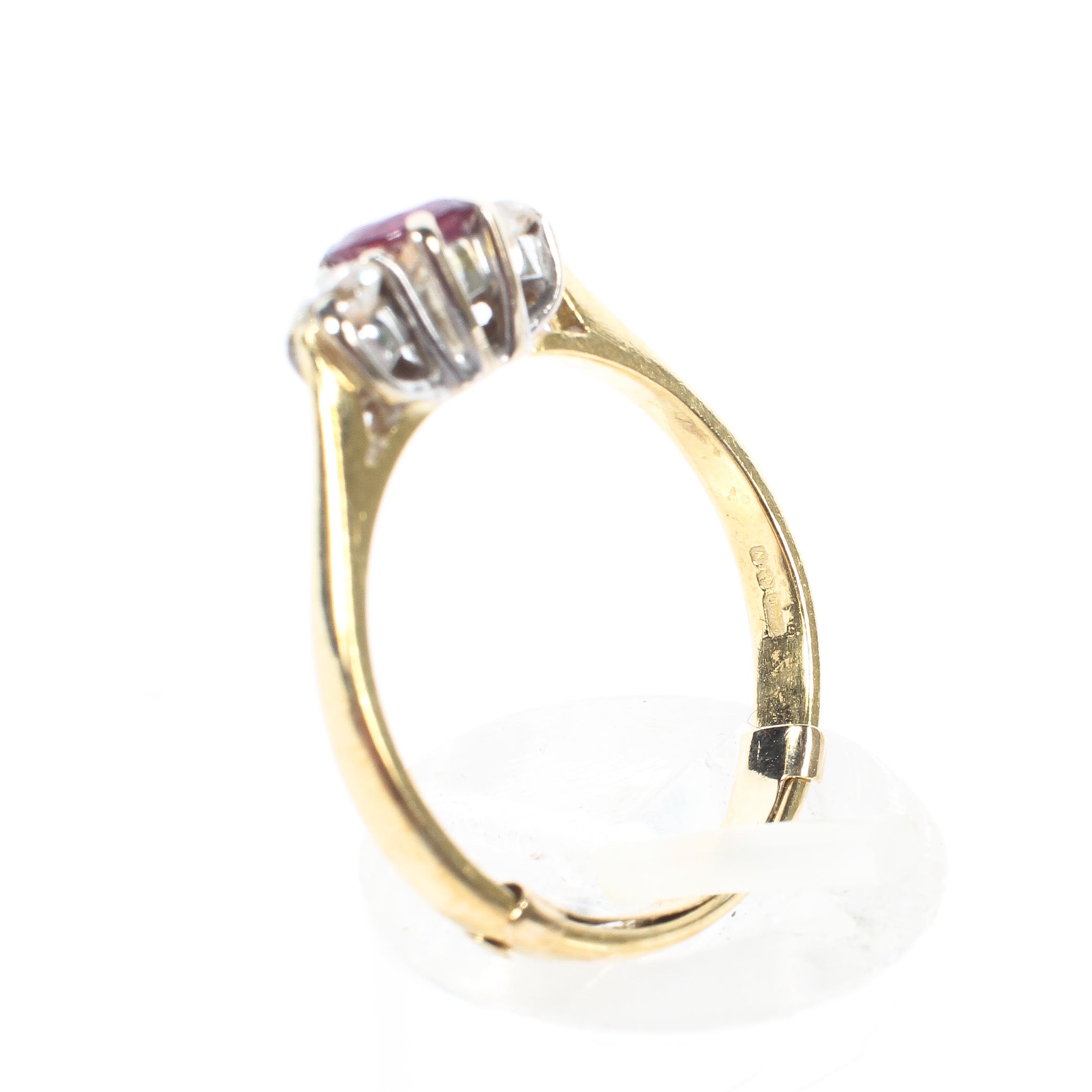 An 18ct gold ruby and two stone diamond dress ring, size N, - Image 4 of 4