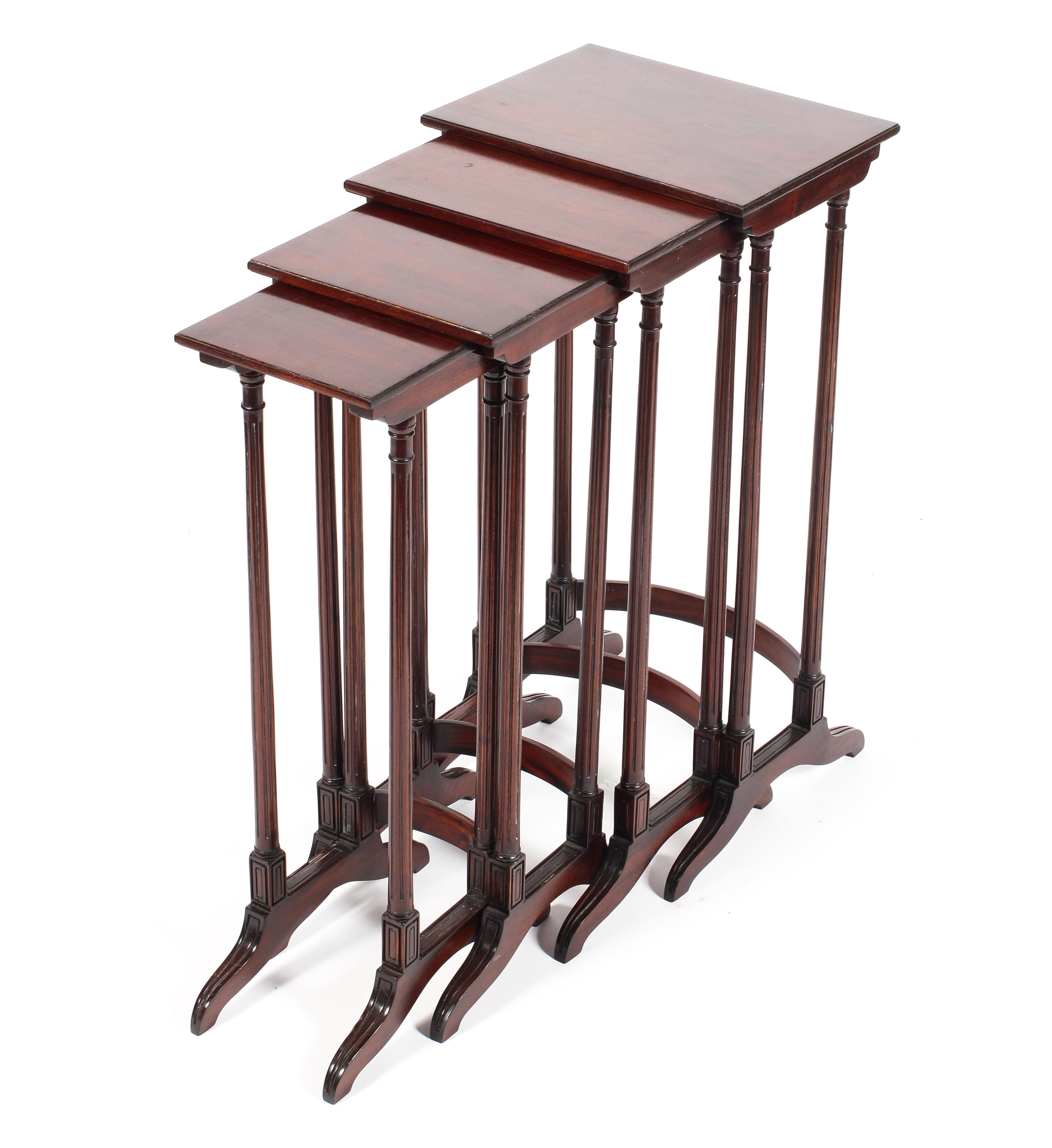 A quartetto nest of mahogany tables on reeded legs and saber supports Condition Report: