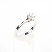 An unmarked white metal and single stone diamond ring, Central 0.