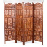 A Indian hardwood for fold screen with pierced panels and all over carved decoration 182cm height