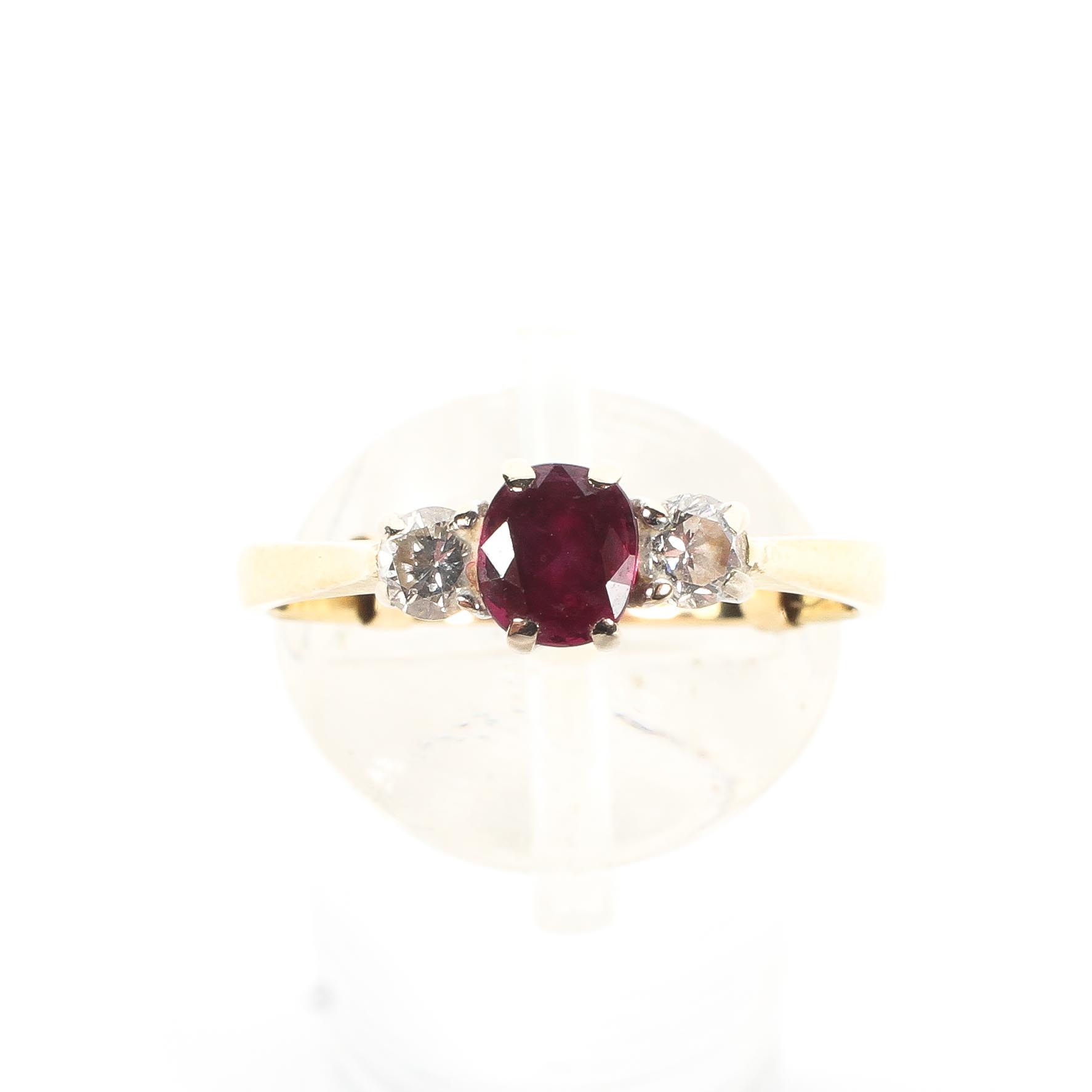 An 18ct gold ruby and two stone diamond dress ring, size N, - Image 2 of 4