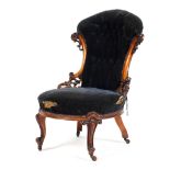 A Victorian mahogany button backed bedroom chair with pierced carved decoration to the wings,