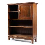 An Edwardian mahogany Sheraton style open bookcase with single cupboard opening to two drawers and