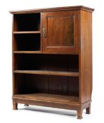 An Edwardian mahogany Sheraton style open bookcase with single cupboard opening to two drawers and