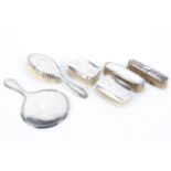 A collection of silver dressing table wares, to include gentlemans clothes brushes,