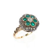 A Victorian yellow metal emerald and diamond cluster ring,