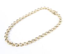 An 18ct yellow gold and diamond set line bracelet,