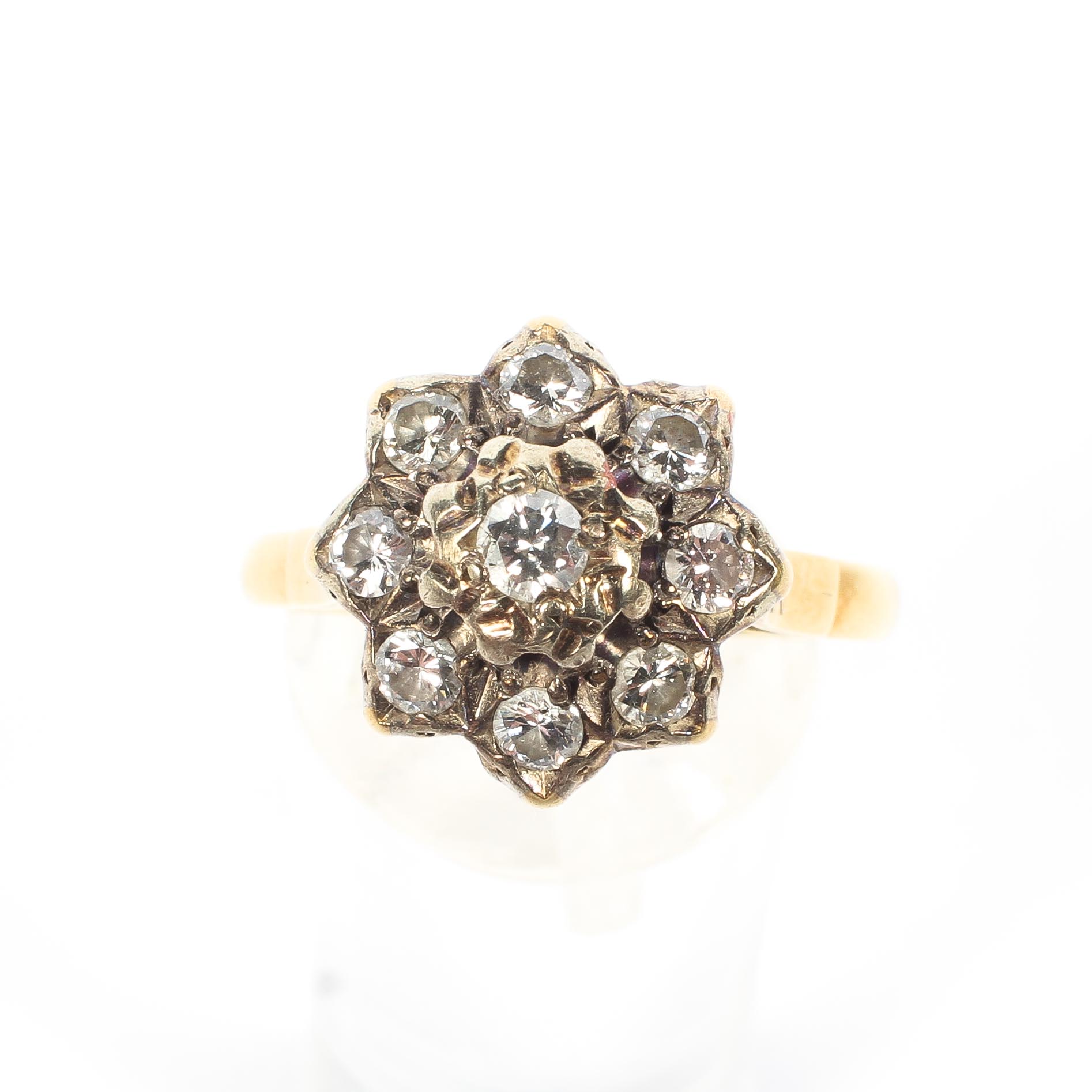 An 18ct gold and diamond cluster ring, set with nine brilliant cut diamonds, central stone approx 0. - Image 2 of 4