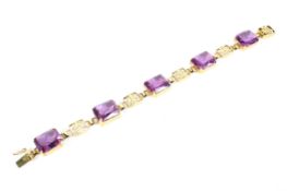 A Hong Kong 14ct gold link amythest bracelet,