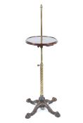 A 19th century brass and iron adjustable etegere with circular mahogany tray