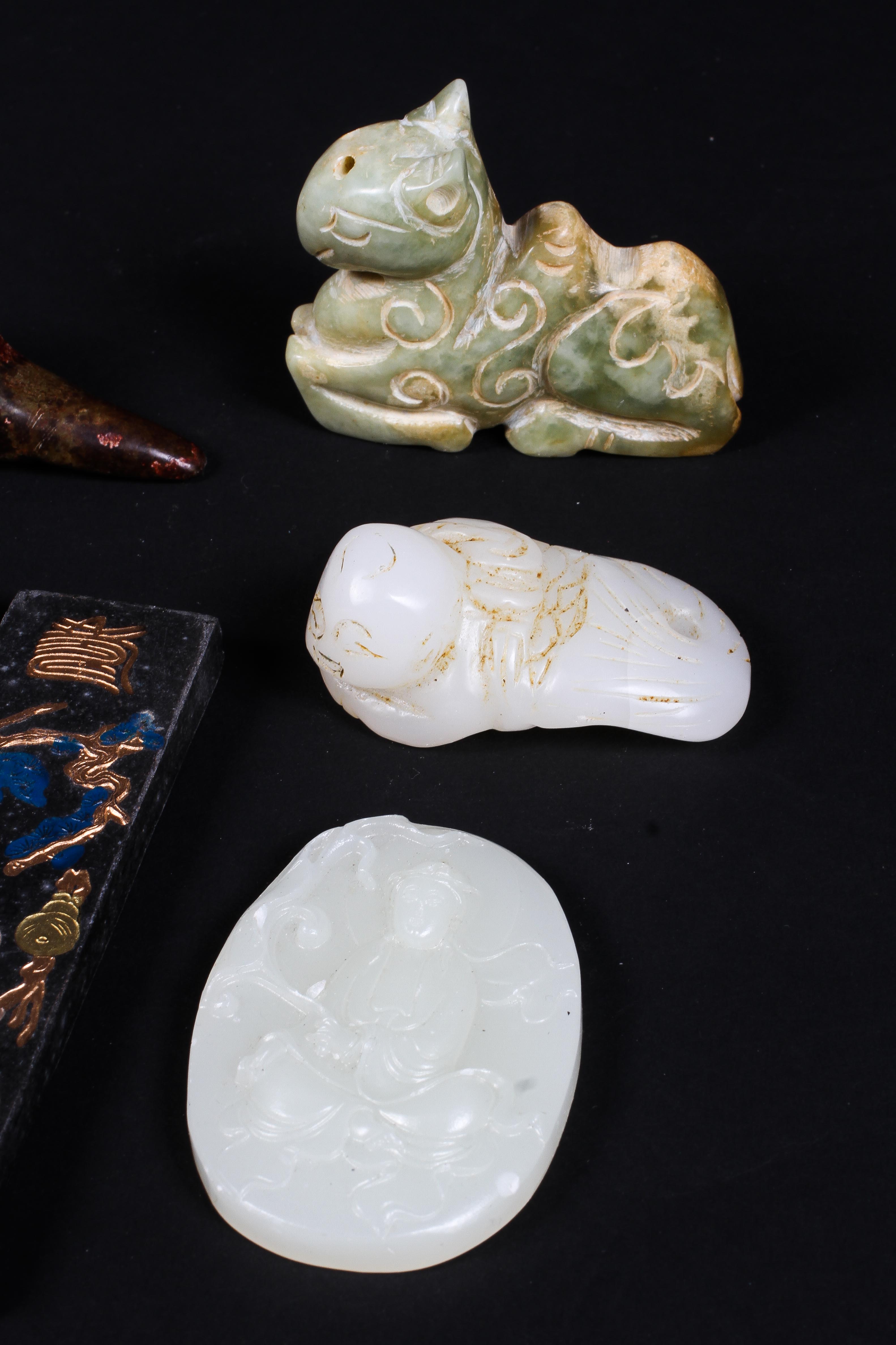 A collection of jade and stone figures, to include four animals of Archaic form, a reclining boy, - Image 2 of 3