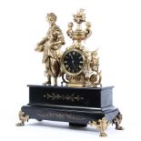 A gilt and slate mantle clock,