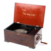 The Imperial', a polyphon music box in mahogany box with eight 9 inch discs and winder, 43.