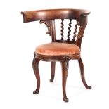 A Victorian mahogany framed tub chair of unusual from, with barley twist splat,