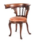 A Victorian mahogany framed tub chair of unusual from, with barley twist splat,