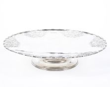 A mid century hallmarked silver Tazza, with pierced flowing motif decoration to its edges,