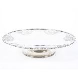 A mid century hallmarked silver Tazza, with pierced flowing motif decoration to its edges,