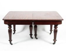 A Victorian mahogany dining table each section with three reeded tulip carved supports to castors