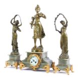 A French onyx and gilt-metal mounted three piece figural clock garniture,