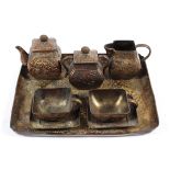 An Oriental style gilt metal miniature tea set.