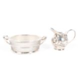 A silver mounted butter dish and a small British import silver cream jug,