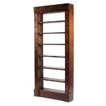 An Edwardian mahogany six shelved open bookcase with hand painted supports columns decorated with