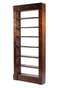 An Edwardian mahogany six shelved open bookcase with hand painted supports columns decorated with