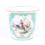 A continental Dresden porcelain ice bucket decorated with birds on a green and white background