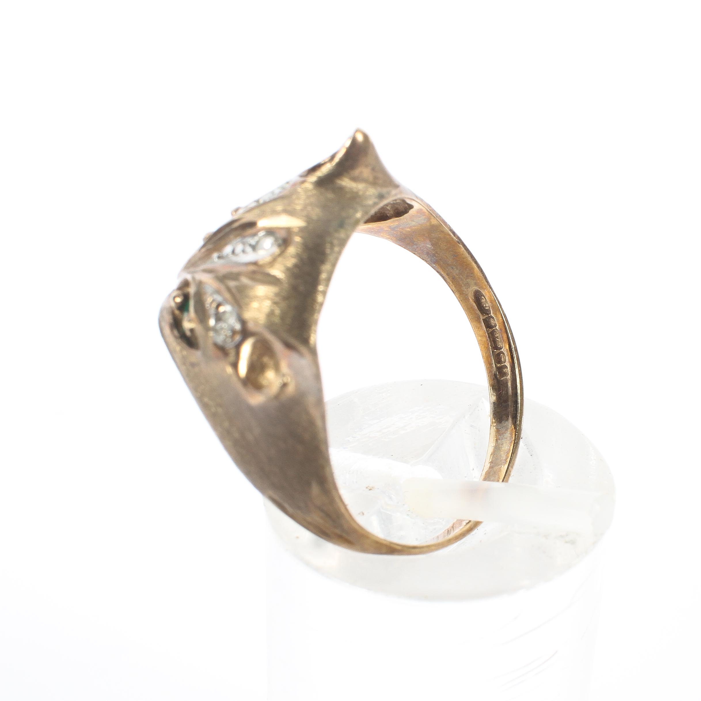 A 9ct gold ring, in the form of a cat's head, set with emerald eyes and single cut diamond accents, - Image 4 of 4