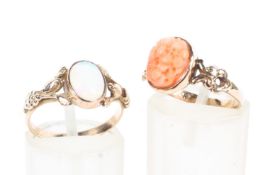 An unmarked yellow metal and opal doublet ring together with a 9ct gold pink coral set ring. 3.6g.