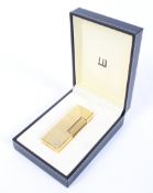 A gold plated Dunhill Rollagas lighter in original box.