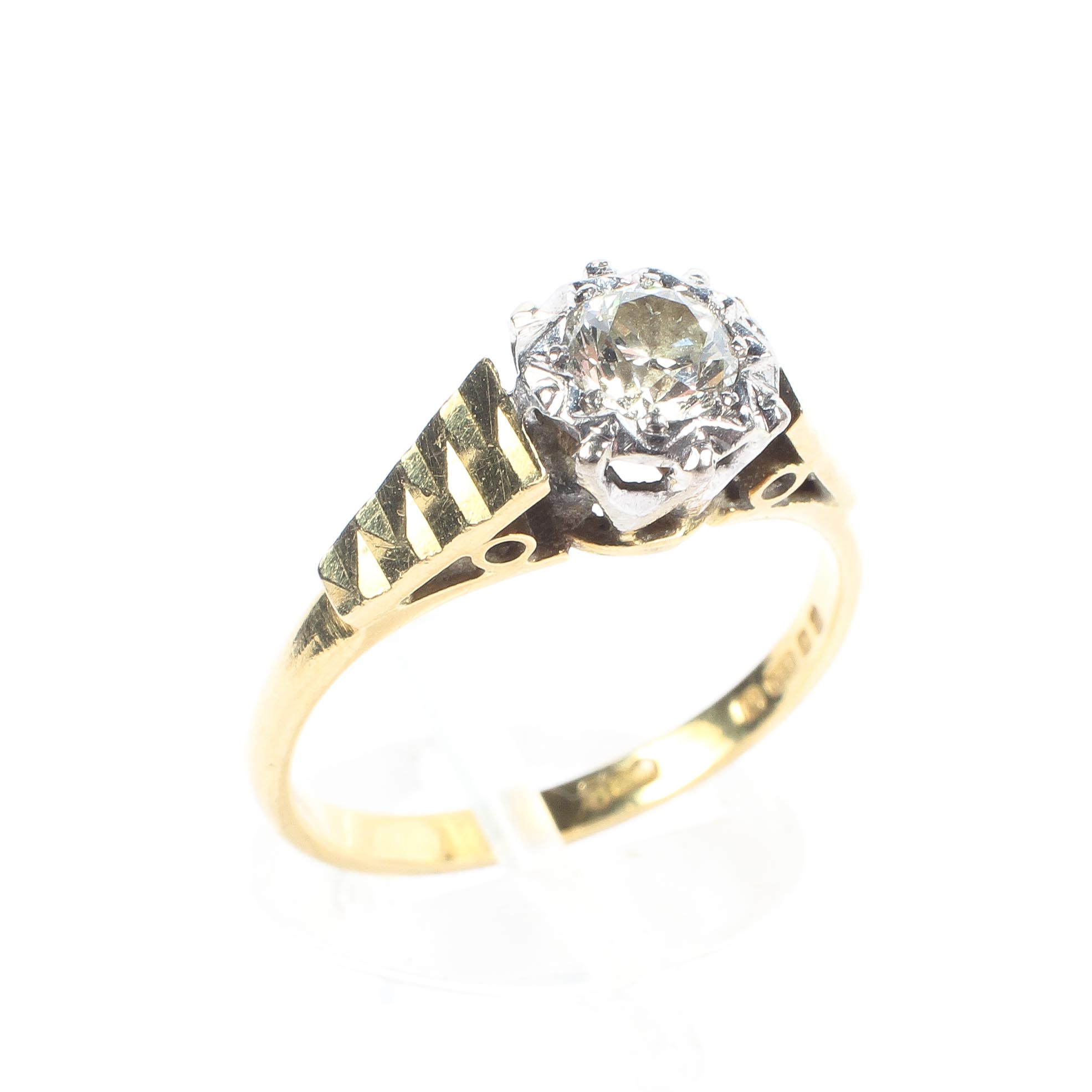 An 18ct yellow and white gold diamond solitaire ring,