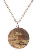 A 9ct yellow gold pendant, one side depicting St Christoper, the opposite a coastal scene,