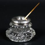 An Edwardian silver mounted glass inkwell together with a silver and mother of pearl handled quill,