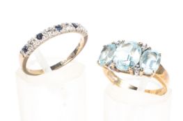 Two ladies 9ct gold gem set rings, one featuring three large blue stones with diamond accents,
