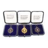 Three music association medals of consecutive dates, 1933-1935, gold silver and bronze, all cased,