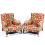 A pair of 20th century Howard style lounge chairs on square tapered legs roll over arm & swept side