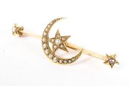 A 15ct yellow gold crescent moon and stars brooch, set with split pearl accents, 3.