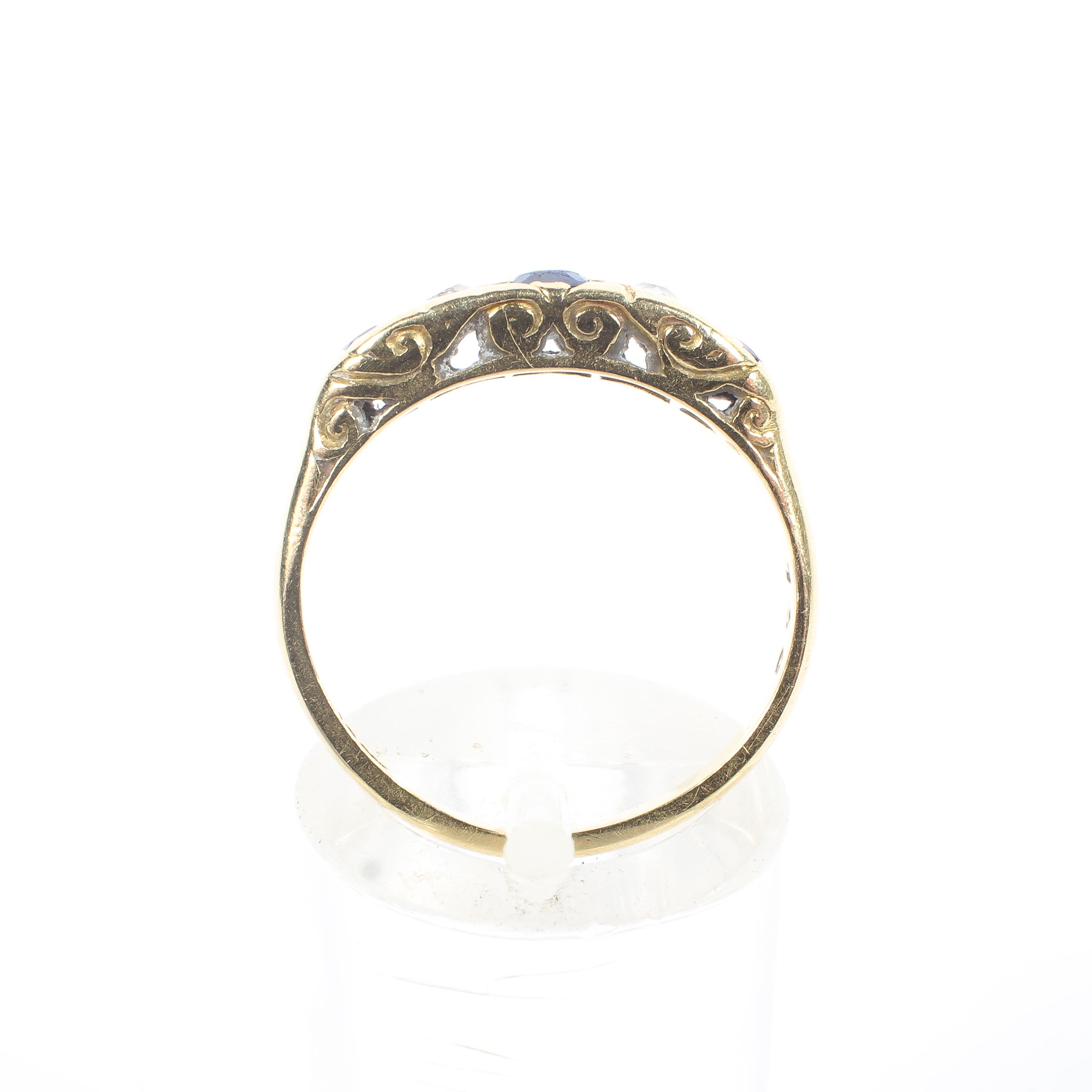 An 18ct yellow gold sapphire and diamond five stone ring, with pierced shank, stamped 18k, 3. - Image 3 of 4