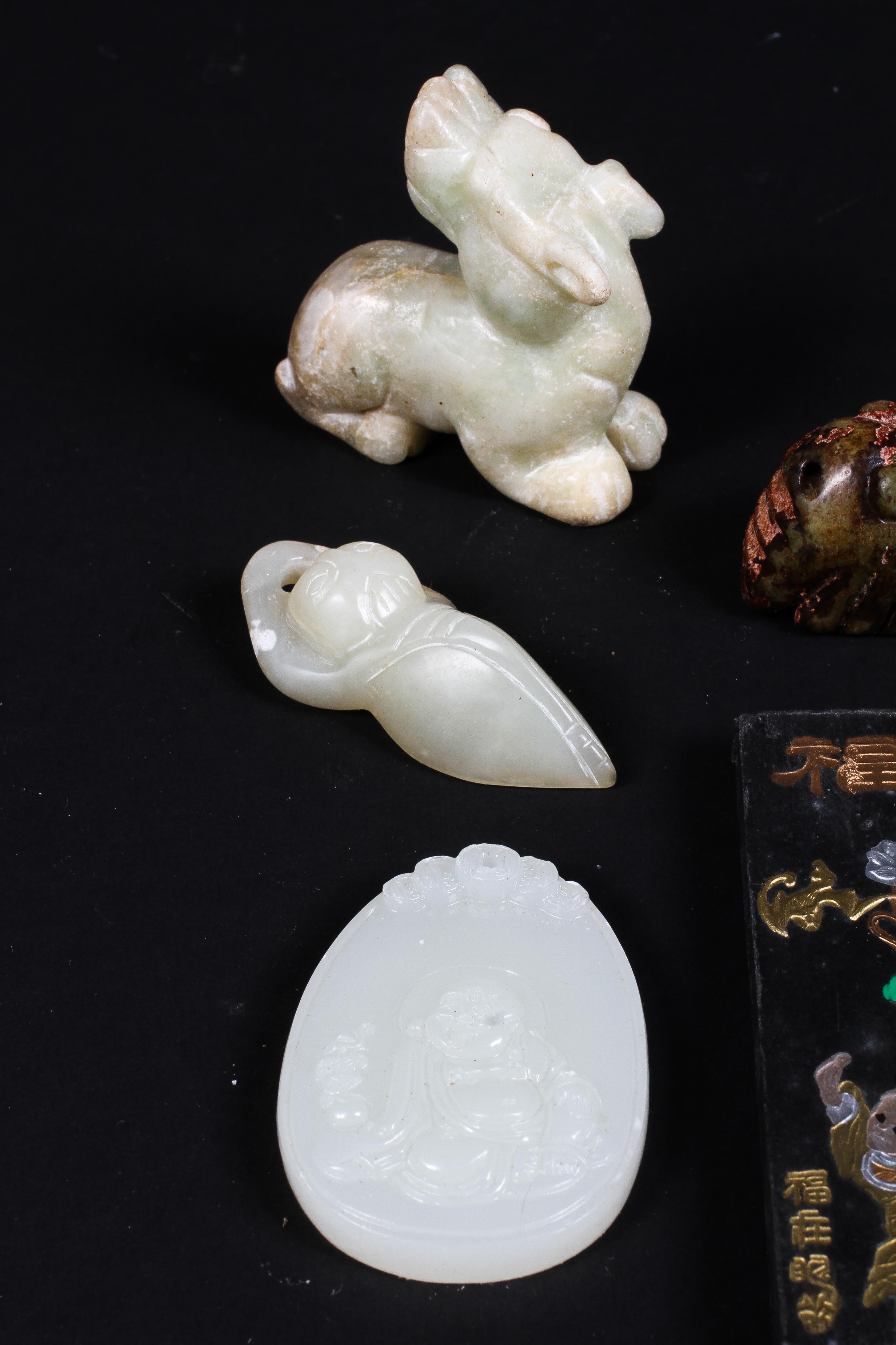 A collection of jade and stone figures, to include four animals of Archaic form, a reclining boy, - Image 3 of 3