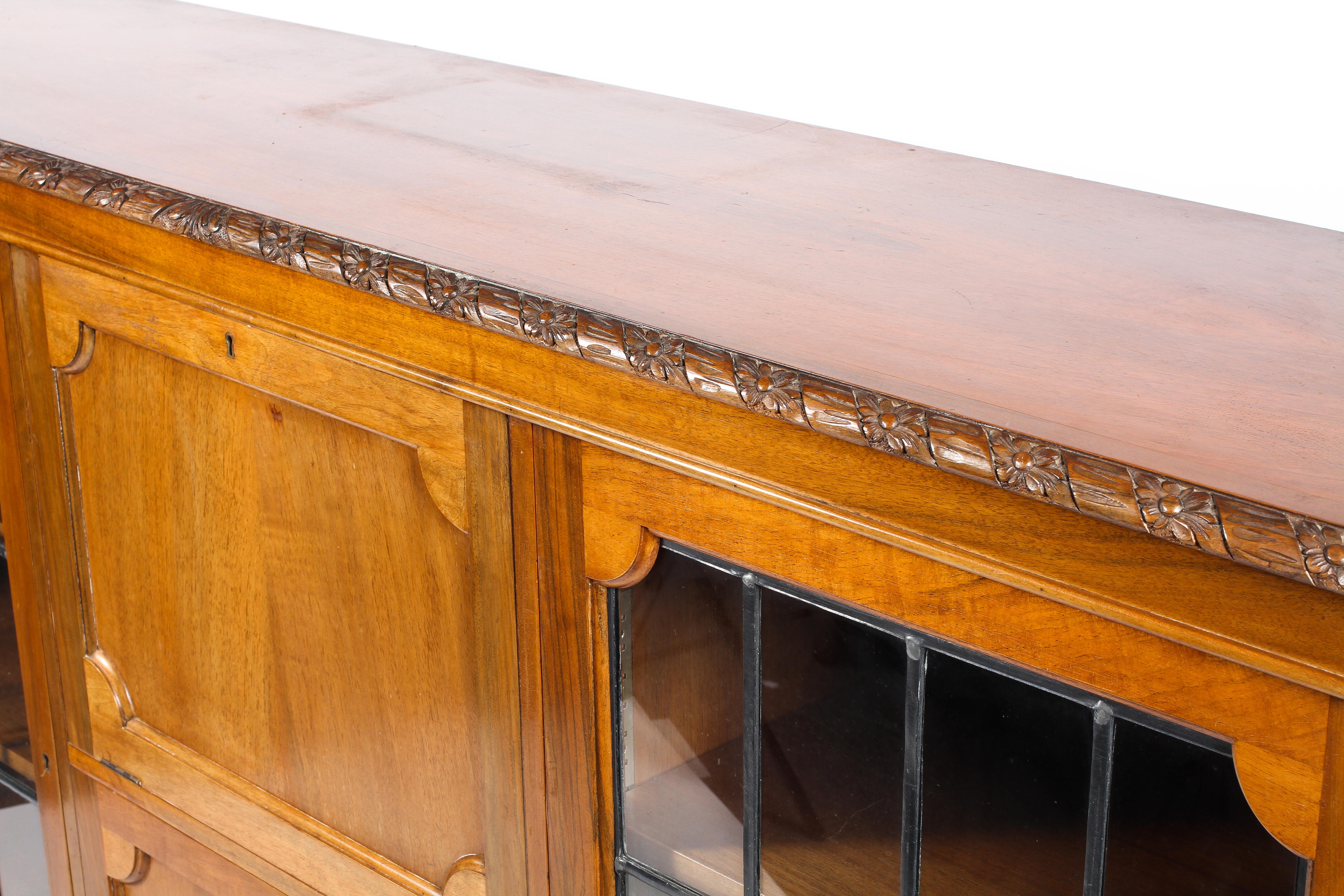 An Edwardian walnut sideboard with carved frieze above a central fall front and cupboard flanked by - Image 2 of 2