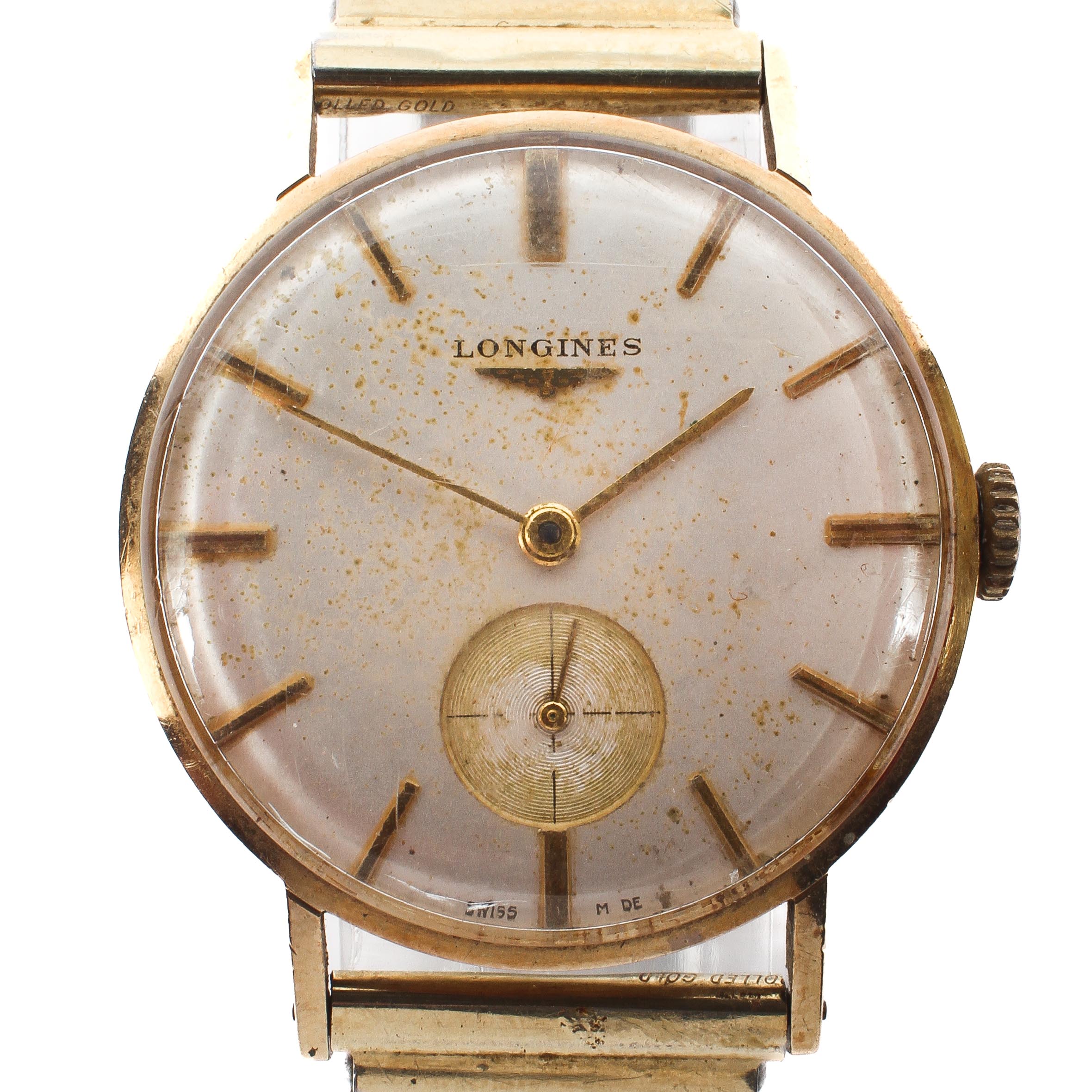 A vintage gents Longines manual wind wristwatch, the silvered dial with gilt batons denoting hours,