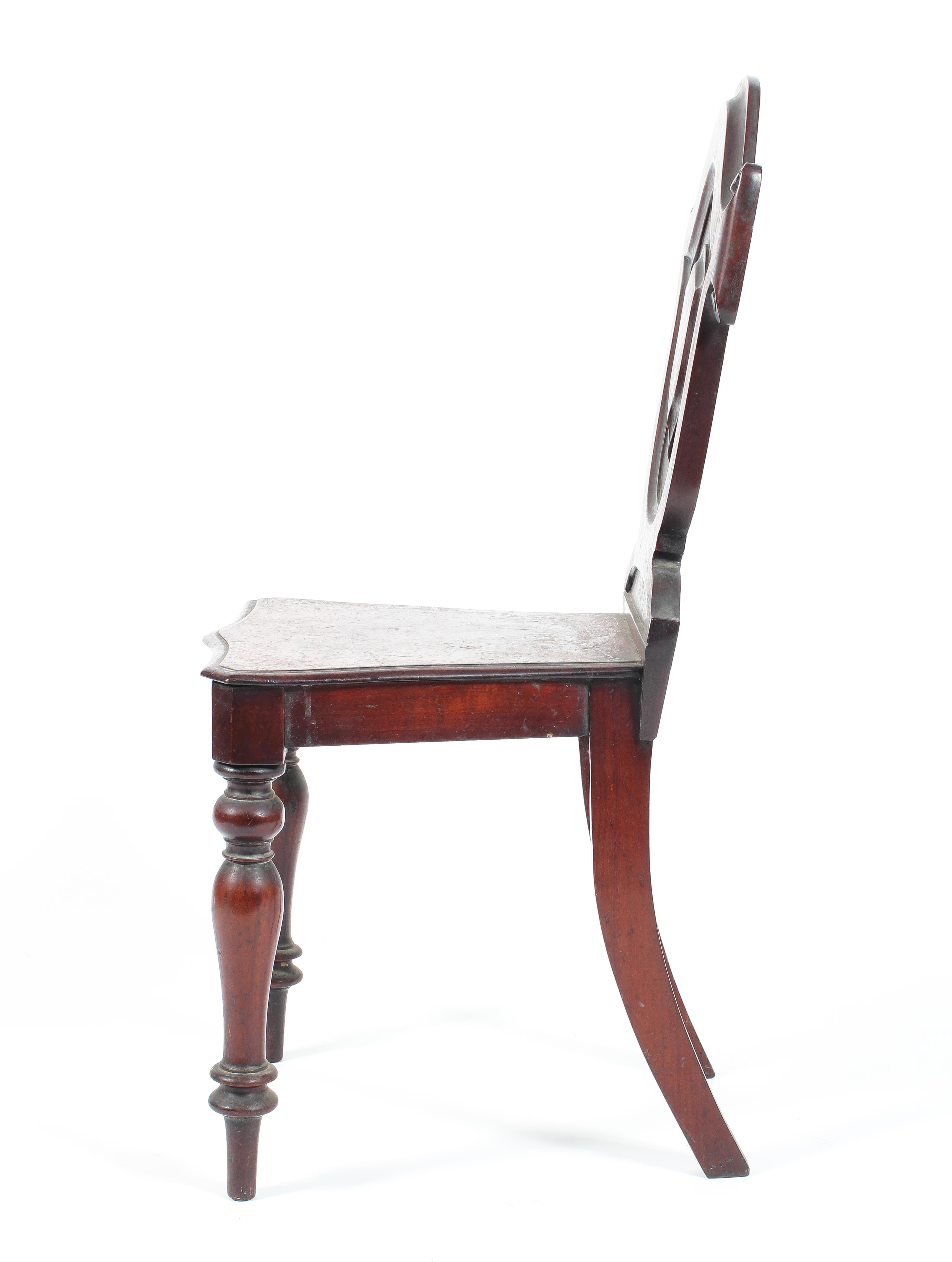 A Victorian mahogany sheildback hall chair raised on turned tapering front supports - Image 2 of 2